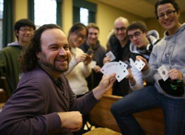 Jeffrey Rosenthal with students holding cards and smiling